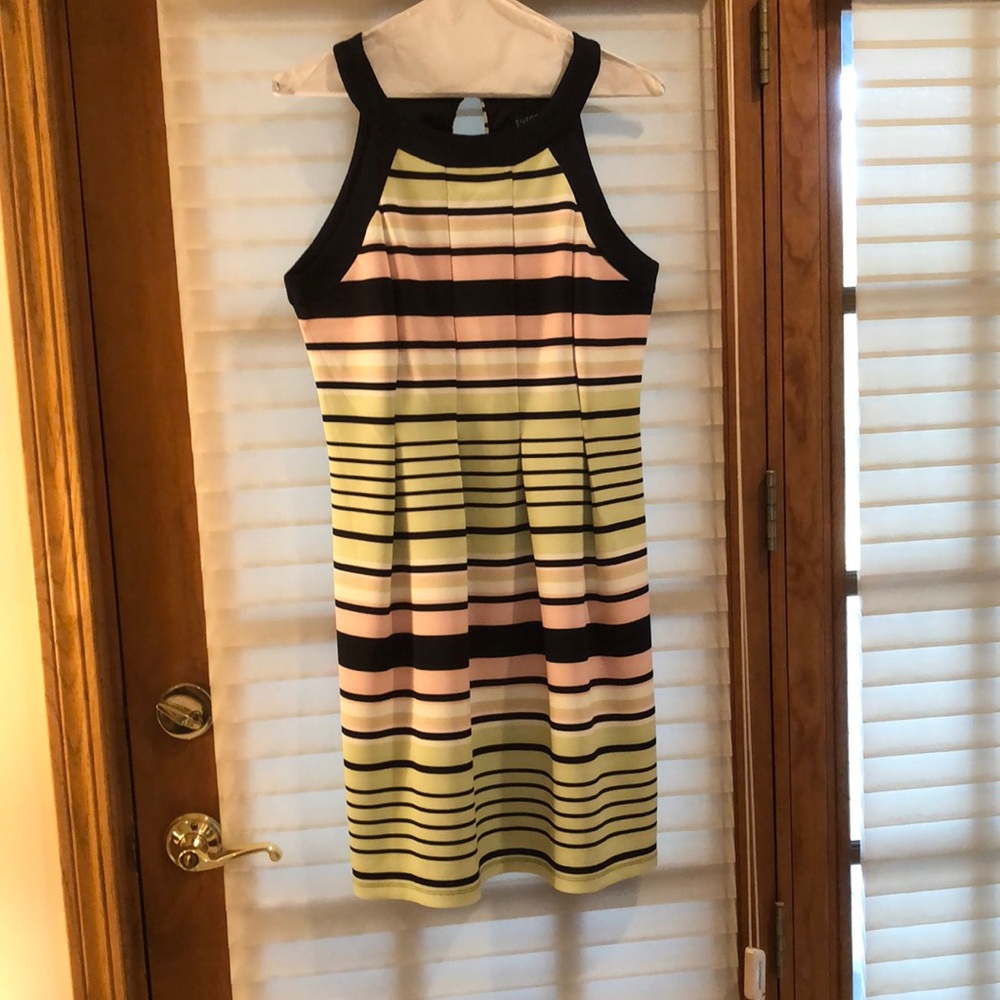 Spring/summer sleeveless dress. Striped black, white, lime green, pink.